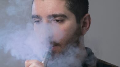 man smoking electronic cigarette